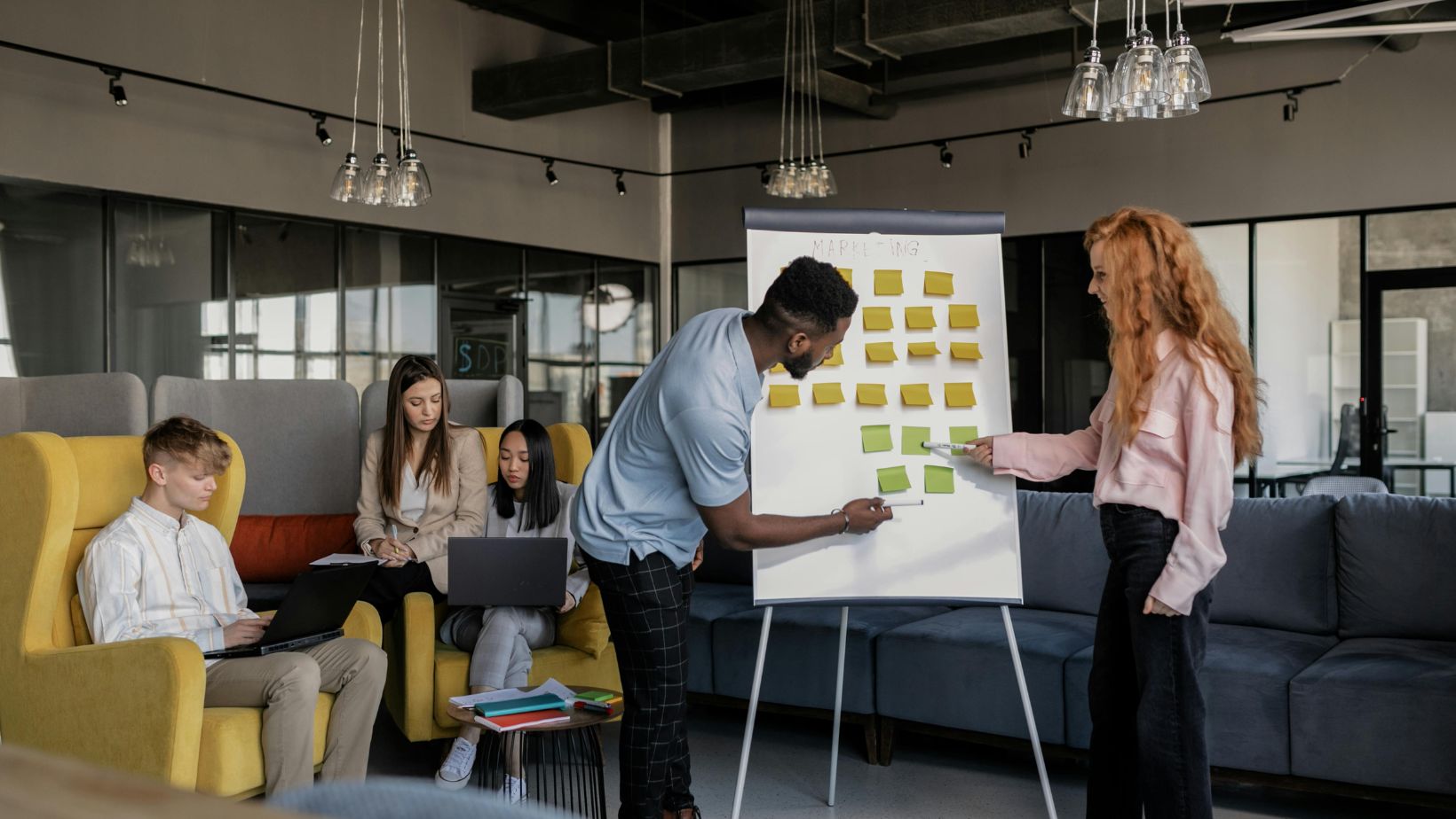 Modern office brainstorming with sticky notes.